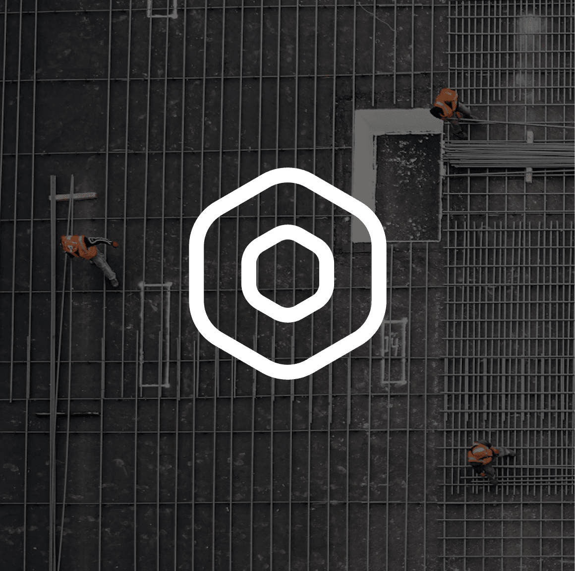Aerial view of a steel and rebar construction site with workers, under a white hexagon nut icon